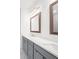 Contemporary bathroom with double vanity, under-mount sinks, and framed mirrors at 3239 Bartee Walk, Suwanee, GA 30024
