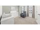Bedroom featuring a white crib, gray rocking chair, and neutral decor at 3239 Bartee Walk, Suwanee, GA 30024