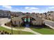 A distant shot of the community clubhouse, pool, and surrounding green spaces, creating a welcoming and attractive setting at 3239 Bartee Walk, Suwanee, GA 30024