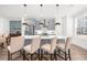 Modern kitchen with gray cabinets, stainless steel appliances, a quartz countertop, and pendant lighting at 3239 Bartee Walk, Suwanee, GA 30024
