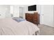 Serene main bedroom with carpet, a large dresser, and ample natural light at 3239 Bartee Walk, Suwanee, GA 30024