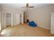 Bedroom featuring two closets, a window providing natural light, and unfinished flooring at 110 Vistacrest Way, Roswell, GA 30075