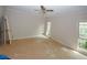Spacious bedroom with ample natural light from the window, a ceiling fan, and unfinished flooring at 110 Vistacrest Way, Roswell, GA 30075