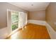 Bedroom view with tan walls, wood flooring, white molding and shutters at 110 Vistacrest Way, Roswell, GA 30075