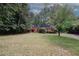 Beautiful brick home with an expansive green lawn and mature trees at 110 Vistacrest Way, Roswell, GA 30075
