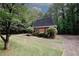Brick home with dark shutters and manicured landscaping at 110 Vistacrest Way, Roswell, GA 30075