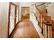 Foyer features wood floors, staircase, and leaded glass front door at 110 Vistacrest Way, Roswell, GA 30075