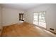 Living room with a large window providing natural light and entry to another room at 110 Vistacrest Way, Roswell, GA 30075