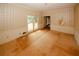 Living room with large window, classic wallpaper, and unfinished flooring at 110 Vistacrest Way, Roswell, GA 30075