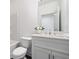 Clean bathroom featuring a shower over the tub, and a white vanity with a large mirror at 244 Church St, Lawrenceville, GA 30046