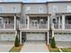 Rear exterior elevation showing three stories with attached garages and balconies at 244 Church St, Lawrenceville, GA 30046
