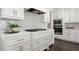 Well-equipped kitchen with white cabinetry, subway tile backsplash, stainless steel appliances, and ample counter space at 244 Church St, Lawrenceville, GA 30046