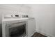 Laundry area features new white washer and dryer with wire shelving for organizing supplies at 244 Church St, Lawrenceville, GA 30046