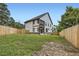 Large backyard with a privacy fence, showcasing space for outdoor activities and landscaping at 2740 Drew Valley Ne Rd, Brookhaven, GA 30319