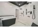 Modern bathroom showcasing a soaking tub and a large walk-in shower with multi shower heads at 2740 Drew Valley Ne Rd, Brookhaven, GA 30319