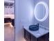 Bathroom with dark cabinets, decorative bowl sink and LED mirror at 2740 Drew Valley Ne Rd, Brookhaven, GA 30319