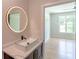 Bathroom with modern sink and round LED mirror at 2740 Drew Valley Ne Rd, Brookhaven, GA 30319
