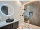 Stunning bathroom features a modern design with a glass enclosed shower and vessel sink at 2740 Drew Valley Ne Rd, Brookhaven, GA 30319