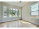 Bright bedroom with hardwood floors, large windows, and neutral paint at 2740 Drew Valley Ne Rd, Brookhaven, GA 30319