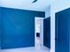 Bedroom with blue accent wall and dark blue doors at 2740 Drew Valley Ne Rd, Brookhaven, GA 30319