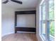 Bedroom featuring a built in television and a large window with natural light at 2740 Drew Valley Ne Rd, Brookhaven, GA 30319