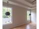 Bedroom featuring modern pendant lights and tray ceiling at 2740 Drew Valley Ne Rd, Brookhaven, GA 30319