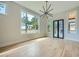 Bright dining room with hardwood floors, large windows, and elegant lighting fixture at 2740 Drew Valley Ne Rd, Brookhaven, GA 30319