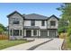 Beautiful two-story home features stone accents, a two-car garage, and a well-manicured front yard at 2740 Drew Valley Ne Rd, Brookhaven, GA 30319
