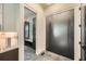 Elegant foyer features marble floors, a sleek front door, and a glimpse of a mudroom at 2740 Drew Valley Ne Rd, Brookhaven, GA 30319