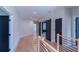 Hallway with shiplap accent wall, wood floors, and sliding doors at 2740 Drew Valley Ne Rd, Brookhaven, GA 30319
