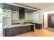 Spacious kitchen featuring white cabinets, dark countertops, a large island with a marble top, and modern appliances at 2740 Drew Valley Ne Rd, Brookhaven, GA 30319