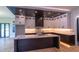 Bright kitchen with custom cabinets, marble countertops, large island, modern appliances, and hardwood floors at 2740 Drew Valley Ne Rd, Brookhaven, GA 30319
