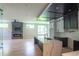 Open concept kitchen featuring a large island, marble countertops, modern appliances, and hardwood floors at 2740 Drew Valley Ne Rd, Brookhaven, GA 30319