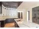 Bright kitchen featuring a large island with marble countertop, custom cabinets, modern appliances, and an open layout at 2740 Drew Valley Ne Rd, Brookhaven, GA 30319