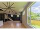 Bright, spacious living room with modern lighting, hardwood floors, and large windows at 2740 Drew Valley Ne Rd, Brookhaven, GA 30319