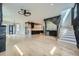 Open-concept living space showcases a modern kitchen, staircase, and hardwood floors at 2740 Drew Valley Ne Rd, Brookhaven, GA 30319