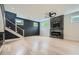 Bright living room features a modern fireplace, wooden floors, and a staircase at 2740 Drew Valley Ne Rd, Brookhaven, GA 30319