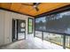 Outdoor living area featuring roll down privacy screen, fan, tile floor, and door to bathroom at 2740 Drew Valley Ne Rd, Brookhaven, GA 30319
