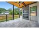 Outdoor patio with a fireplace, ceiling fan, and wooden ceiling at 2740 Drew Valley Ne Rd, Brookhaven, GA 30319