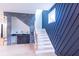 Stylish staircase with dark accent walls and natural wood railings at 2740 Drew Valley Ne Rd, Brookhaven, GA 30319