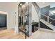 A refined wine cellar is featured, blending sleek design with function by the staircase at 2740 Drew Valley Ne Rd, Brookhaven, GA 30319