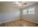 Cozy bedroom with hardwood floors, neutral walls, and window at 3710 A B Lynn Dr, Powder Springs, GA 30127