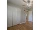 Bedroom featuring ceiling fan, hardwood floors and a closet at 3710 A B Lynn Dr, Powder Springs, GA 30127