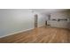Bright living room with hardwood floors, neutral paint, and doorway leading to other rooms at 3710 A B Lynn Dr, Powder Springs, GA 30127