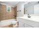 Bathroom with modern fixtures, bathtub, and tile accents at 7248 Banks Mill Rd, Douglasville, GA 30135