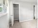 This bedroom showcases natural light with ample closet space for convenient and organized living at 7248 Banks Mill Rd, Douglasville, GA 30135