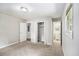 This bedroom offers neutral colors and three doorways, one to the bathroom at 7248 Banks Mill Rd, Douglasville, GA 30135