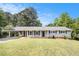 Charming one story home with manicured lawn and covered carport at 7248 Banks Mill Rd, Douglasville, GA 30135