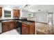 Bright kitchen with dark countertops, breakfast bar, and open floor plan at 7248 Banks Mill Rd, Douglasville, GA 30135
