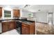 Modern kitchen showcasing wooden cabinets, sleek appliances, and a decorative backsplash for added style at 7248 Banks Mill Rd, Douglasville, GA 30135